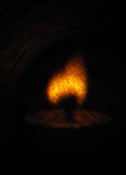 This picture was taken with a pinhole camera (it depicts a flame and a candle)